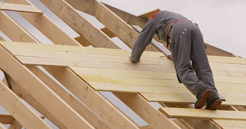 Roofer installing roof decking
