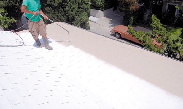 silicone roof top coat being applied