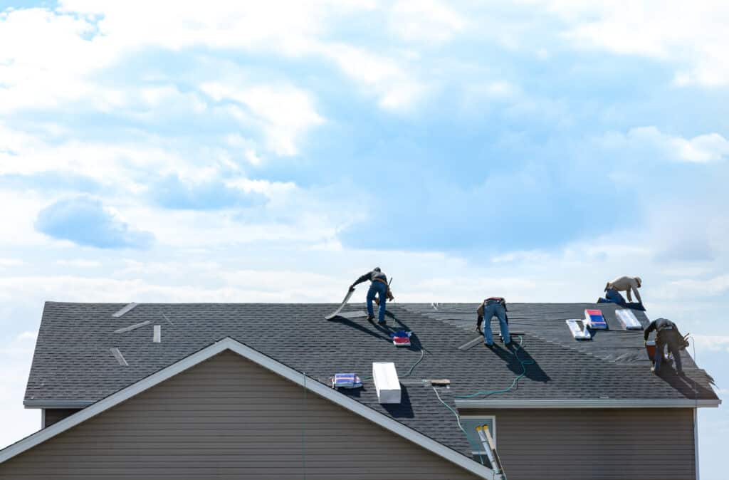 Roofing business crew on roof